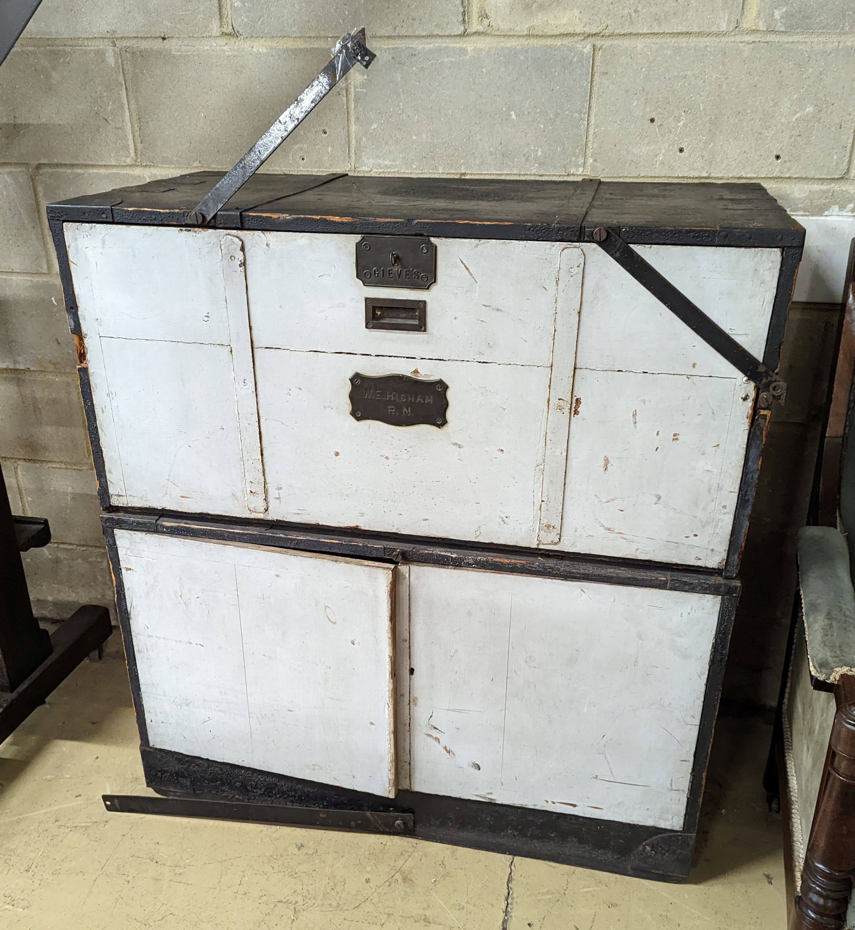 An early 20th century painted and stained pine campaign chest - owners name plate for W.E Higham, R.N. , retailers name plate Gieve’s. W-106cm, D-54cm, H-114cm.